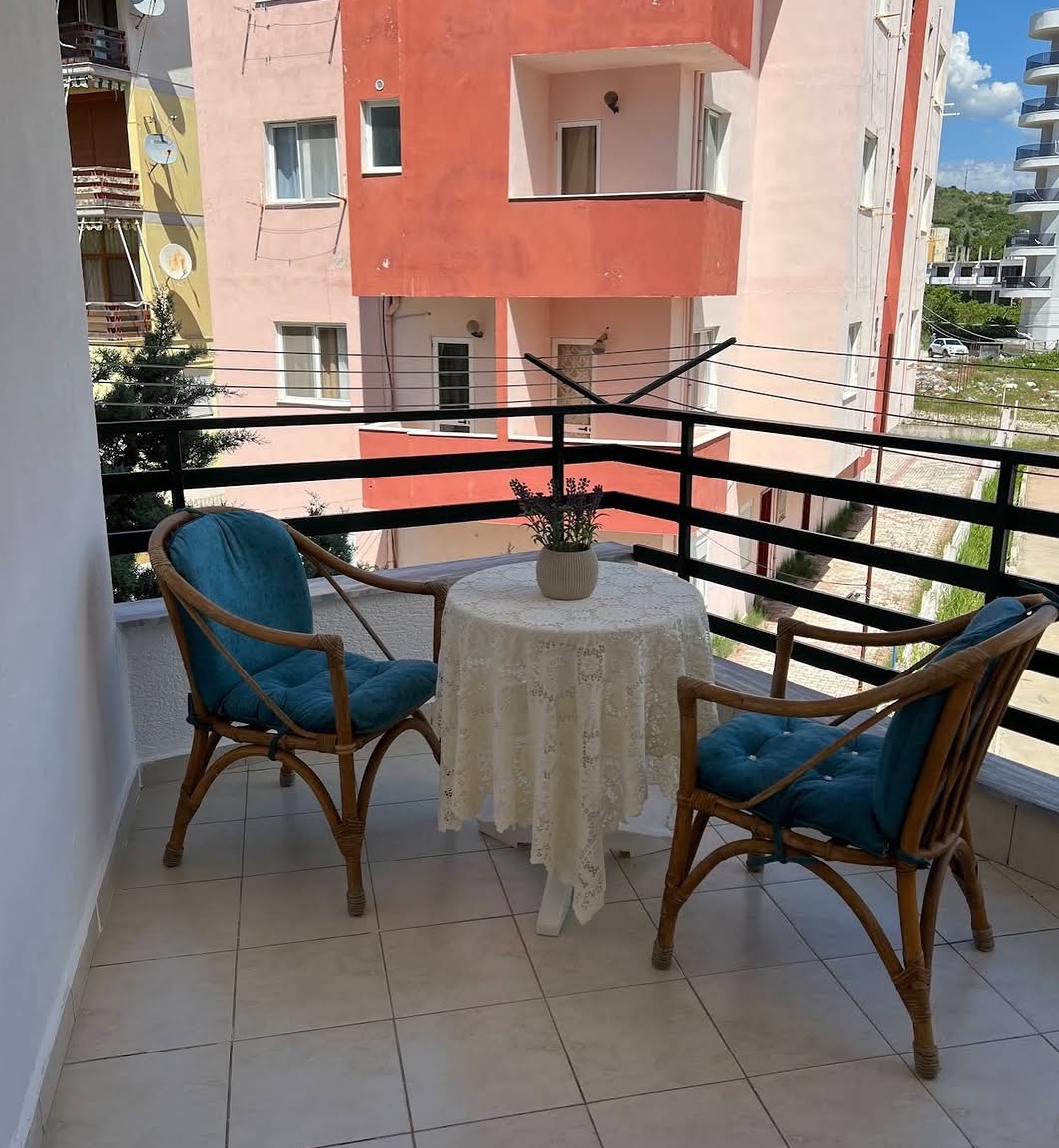Balcony with teal chairs